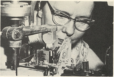 RCA Employee Inspecting A Tube In The Cage Maker